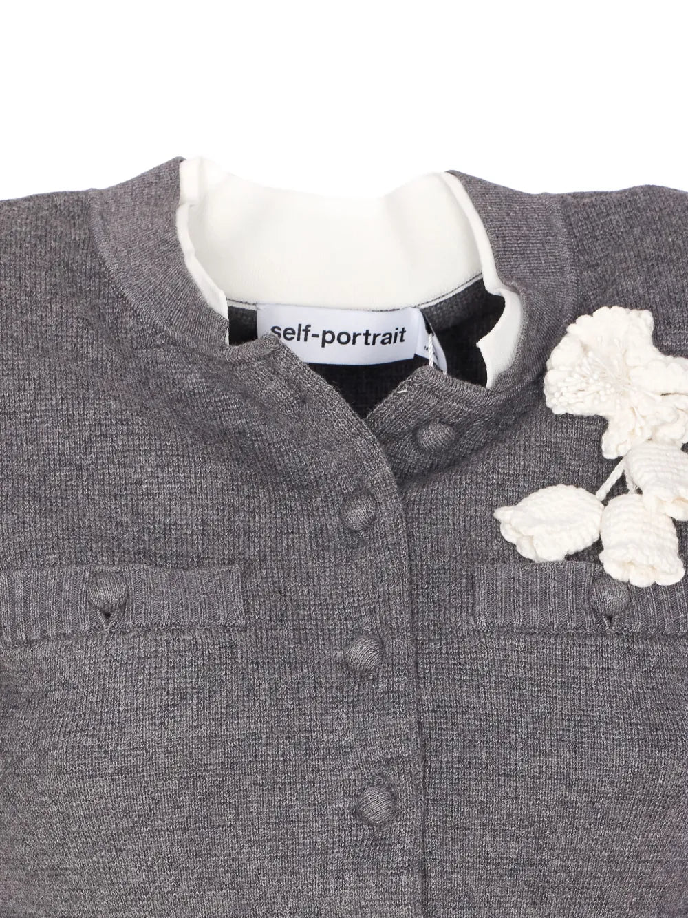 Buttoned cardigan with crochet flower